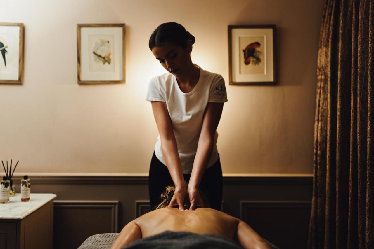 The Ned Hotel London Eksteriør billede A massage therapist treating a patient